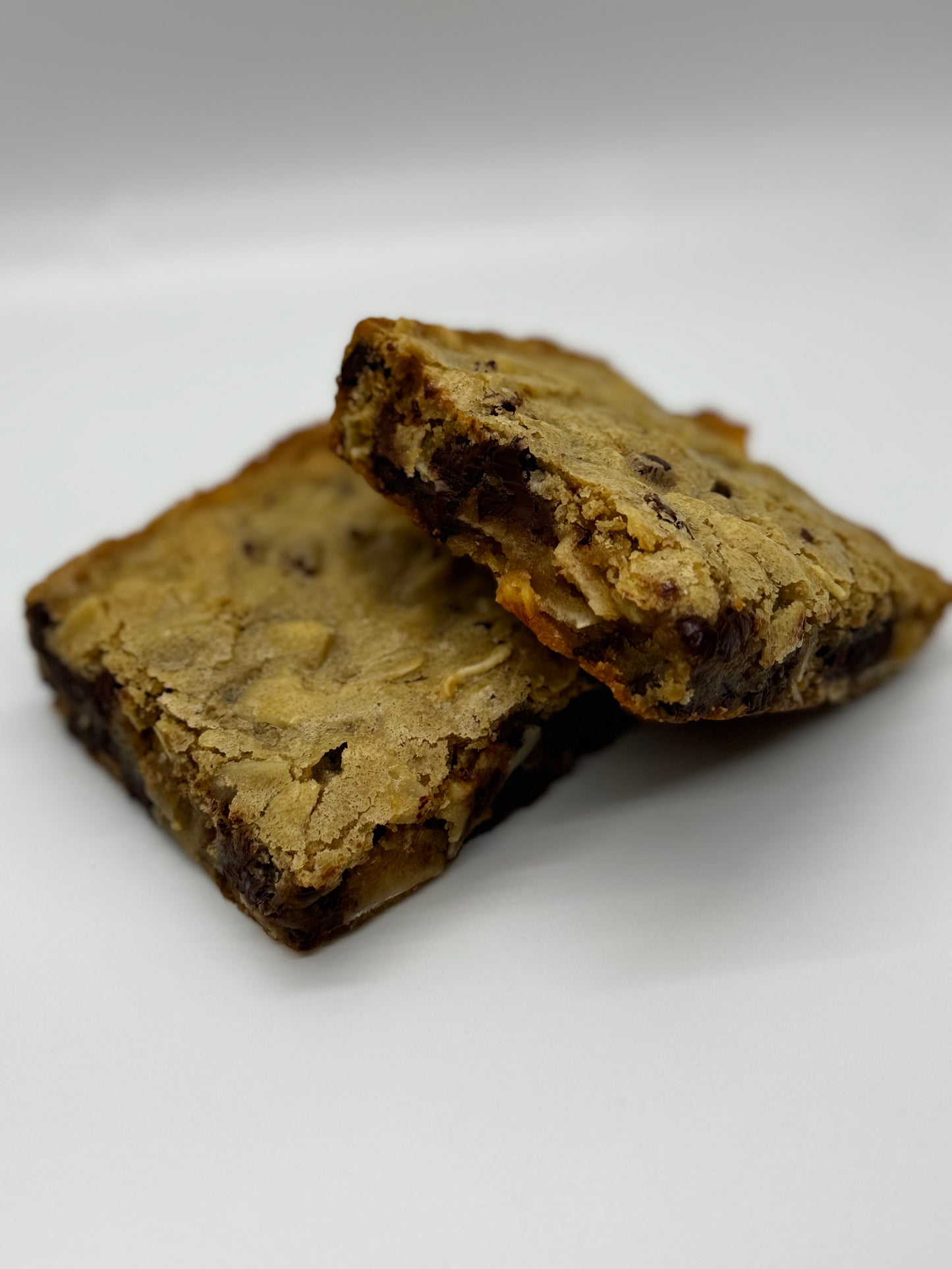 meltaway coconut dark chocolate blondie two stacked