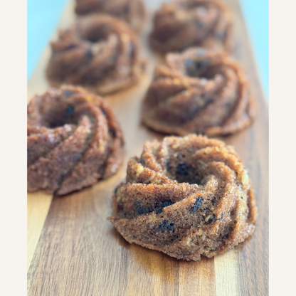 Carrot cake mini bundt cakes ready for an event on wooden board
