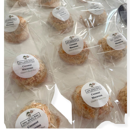 Packaged coconut macaroons with One More Bite Organic packaging. Organic peanut-free coconut macaroon – gluten-free, dairy-free, soy-free, corn-free dessert handmade in Fort Myers, Florida.