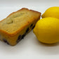 Picture of lemon blueberry sweet bread loaf with two lemons