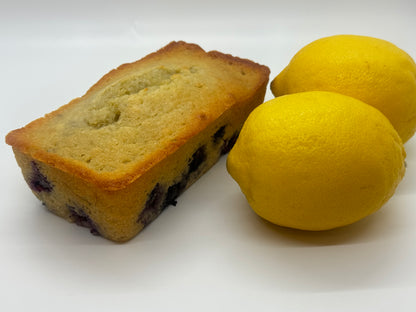 Picture of lemon blueberry sweet bread loaf with two lemons
