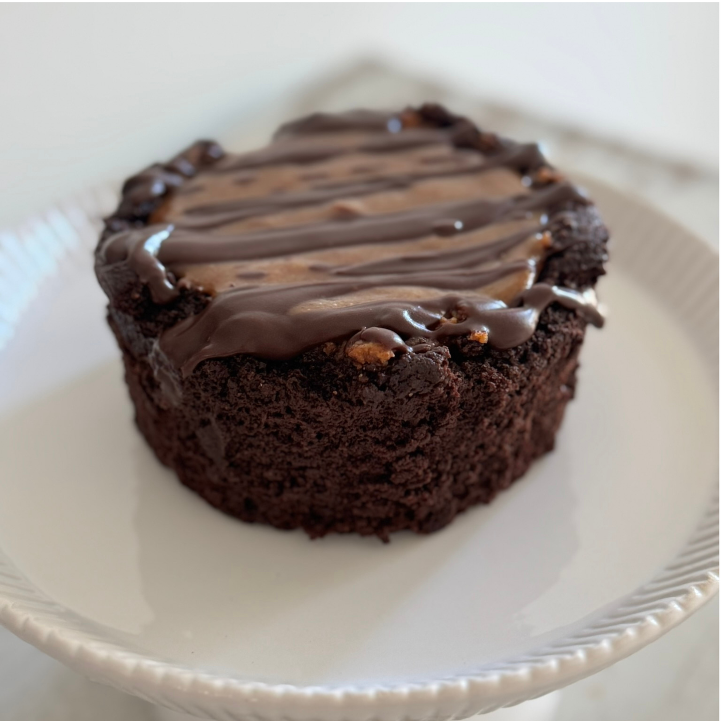 Photo of organic, peanut-free, gluten-free, dairy-free, vegan chocolate almond cake with coconut chocolate ganache – soy-free, corn-free happy birthday celebration dessert handmade in Fort Myers, Florida.