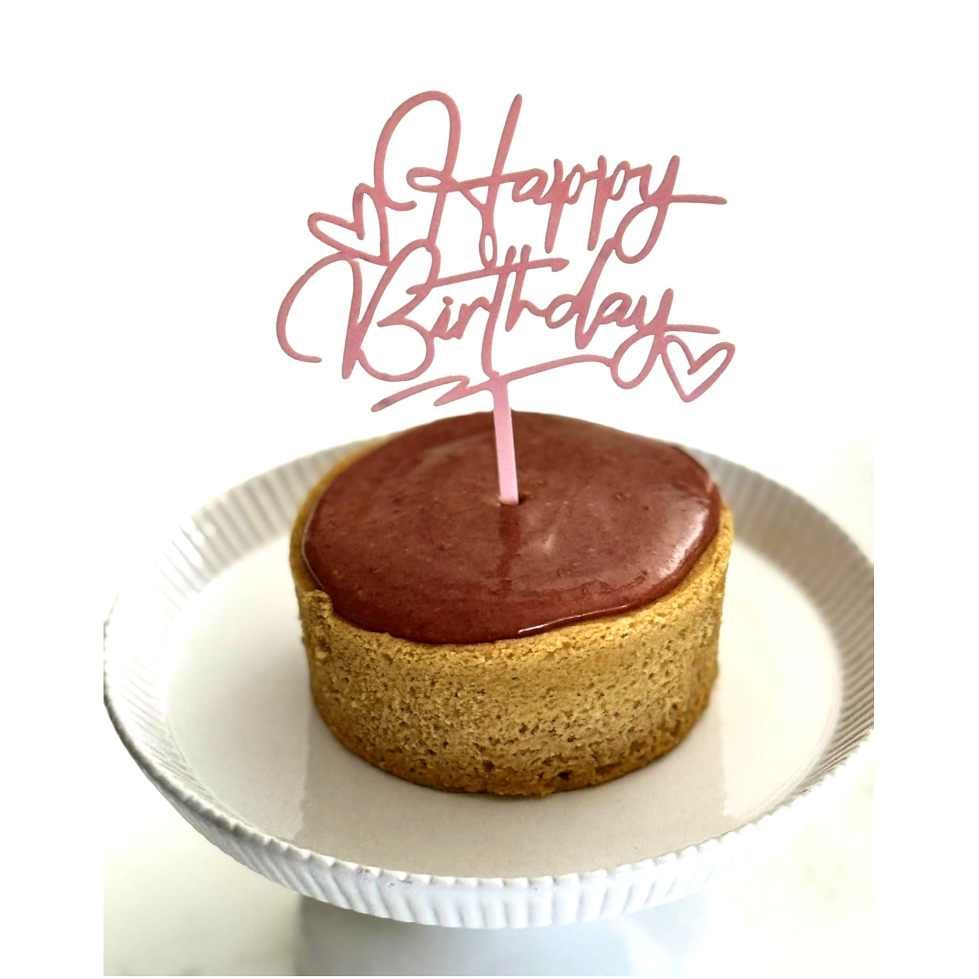 Photo of organic, peanut-free, gluten-free, dairy-free, vegan vanilla cake with raspberry ganache frosting – soy-free, corn-free happy birthday celebration dessert handmade in Fort Myers, Florida.