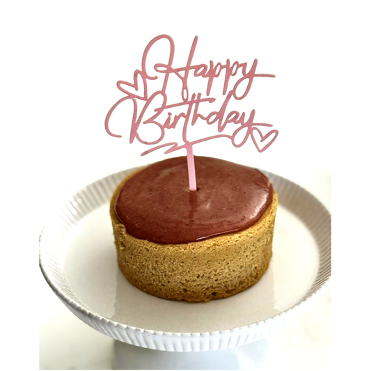 Photo of organic, peanut-free, gluten-free, dairy-free, vegan vanilla cake with raspberry ganache frosting – soy-free, corn-free happy birthday celebration dessert handmade in Fort Myers, Florida.